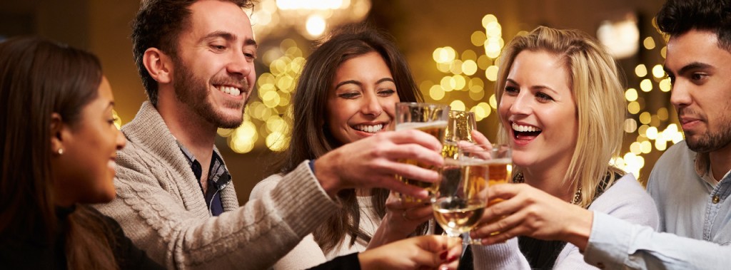 Group Of Friends Enjoying Evening Drinks In Bar